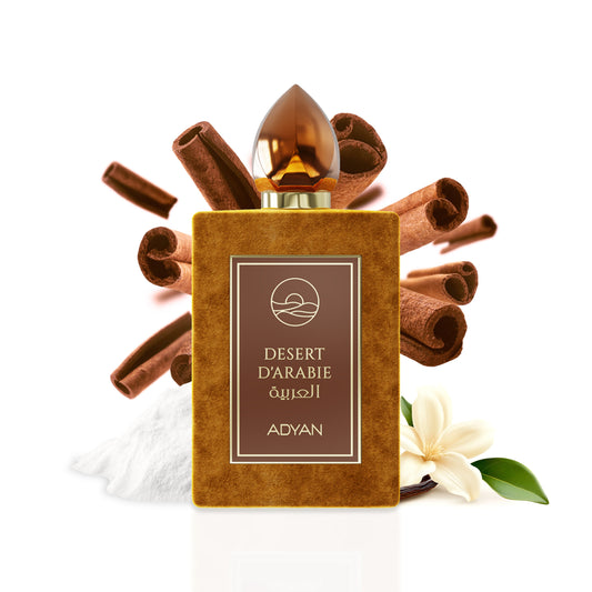 Perfume bottle labeled 'Desert d'Arabie' by Adyan with cinnamon sticks and vanilla flowers on a white background