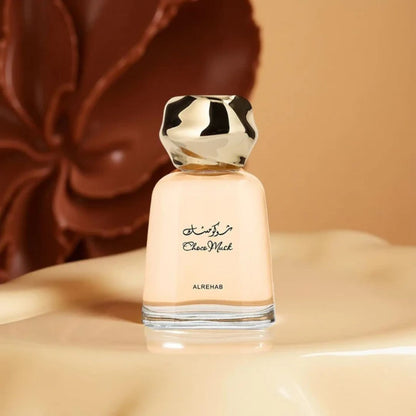 Al Rehab Choco Musk Unisex Eau De Parfum 100ml bottle on soft beige surface