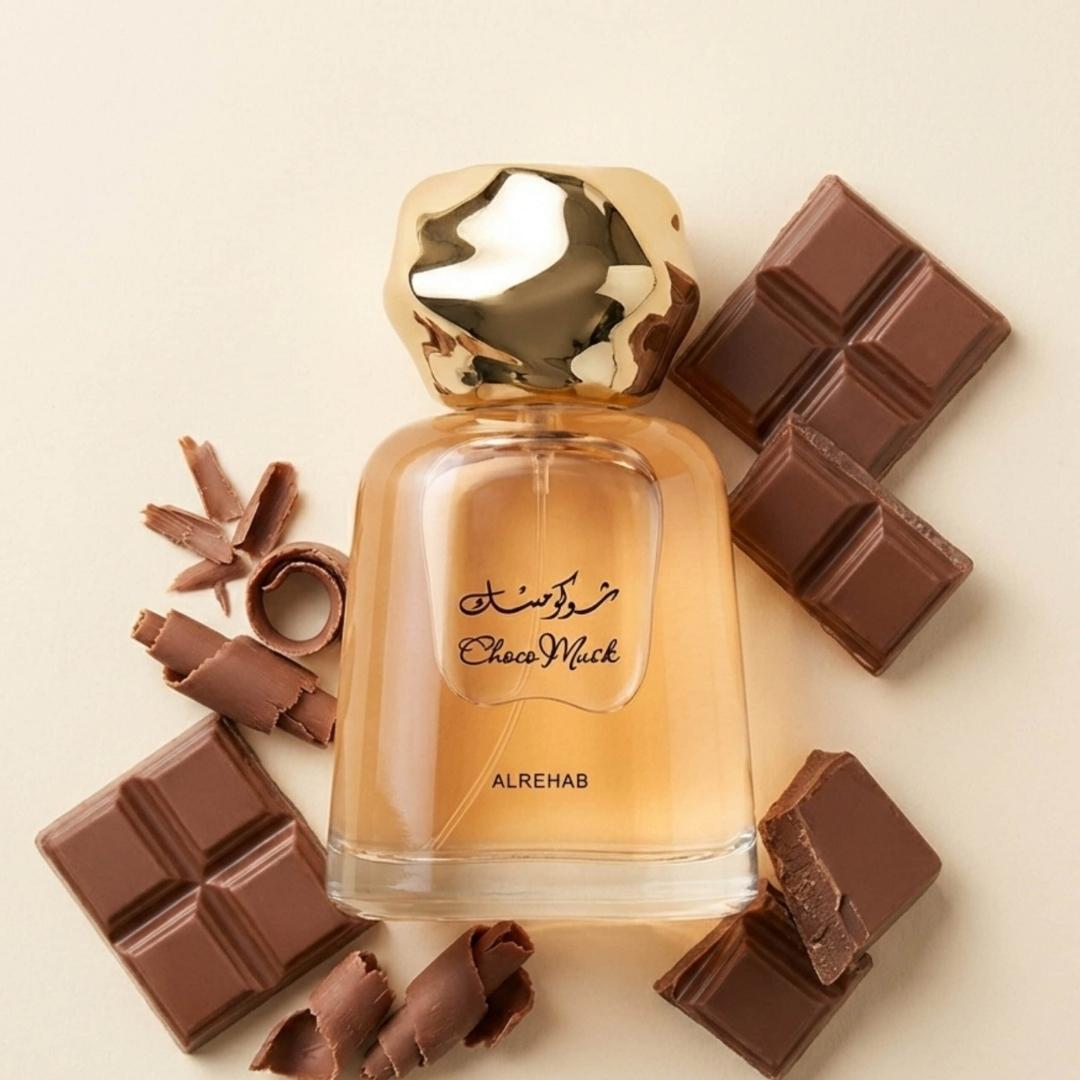 Al Rehab Choco Musk Unisex Eau De Parfum 100ml bottle with chocolate pieces around