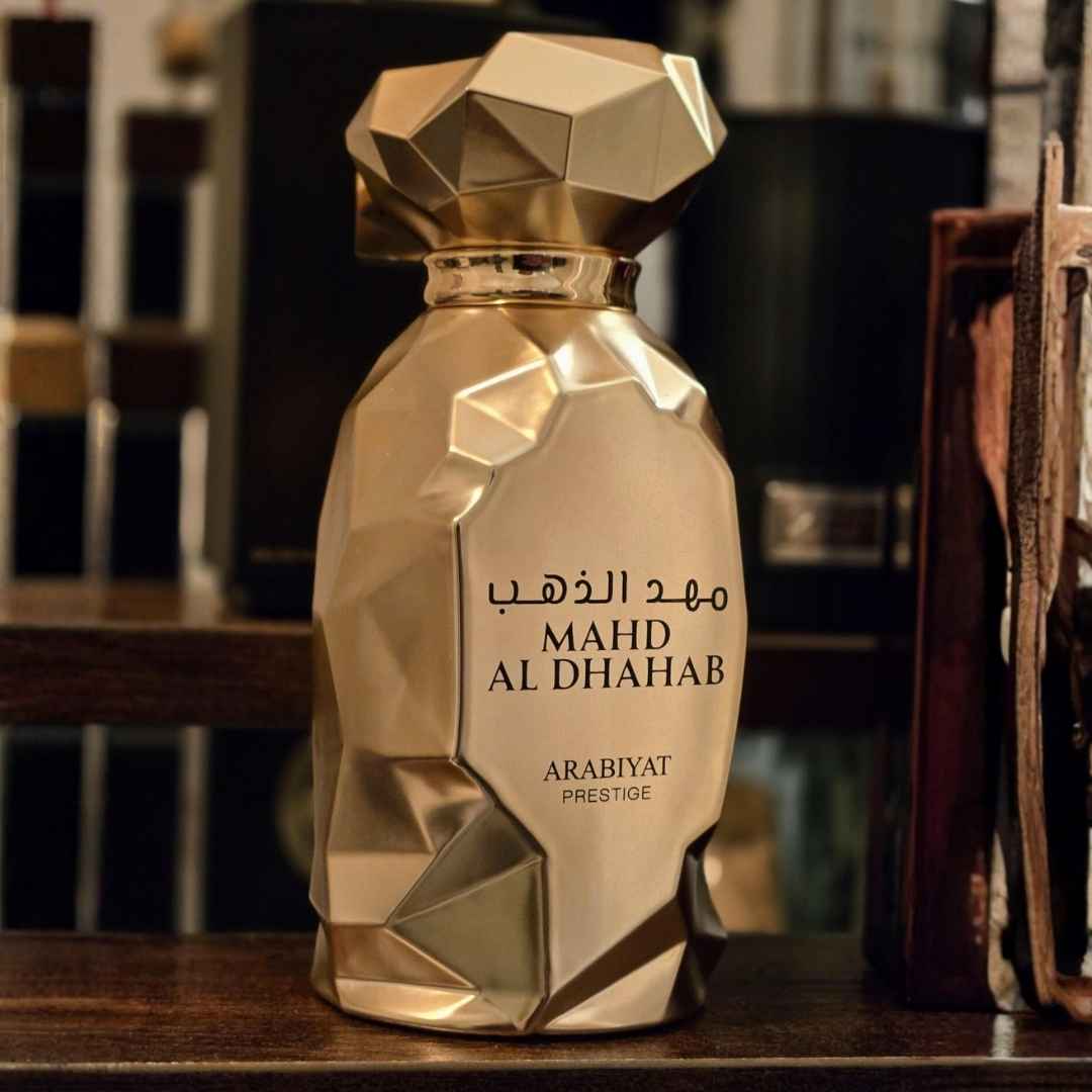Arabiyat Prestige Mahd Al Dhahab EDP 100ml bottle on wooden shelf
