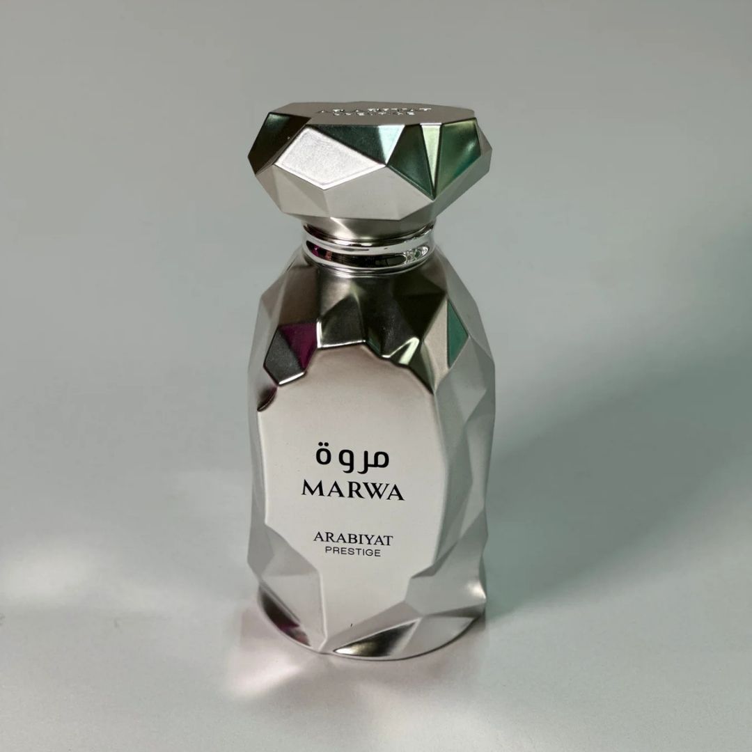 Arabiyat Prestige Marwa Eau de Parfum 100ml for Men bottle on wooden table indoors