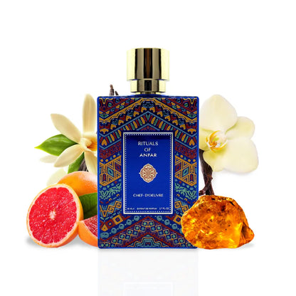 Chef-D'Oeuvre 80ml Rituals Of Anfar Perfume bottle with colourful packaging surrounded by perfume notes fruits and flowers on a white background