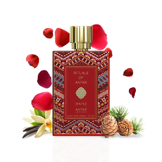Divine Rituals of Anfar Perfume bottle with decorative label surrounded by red petals and vanilla beans on a white background