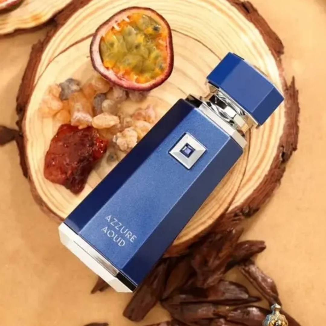 French Avenue Azzure Aoud Eau de Parfum 100ml bottle on wood with passion fruit