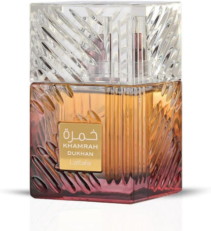 Perfume bottle with textured glass design and 'Khamrah Dukhan' label on a white background