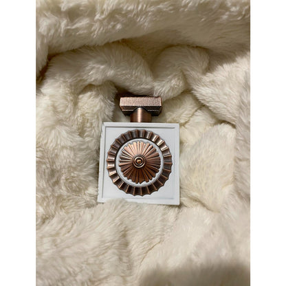 Lattafa Nebras Elixir 100ml EDP bottle on soft fur