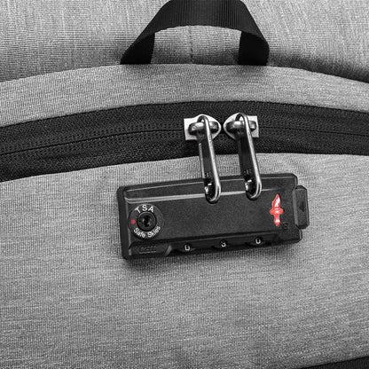 Close-up of a gray suitcase with a TSA-approved lock on a matching gray background best travel laptop backpack multi-functional