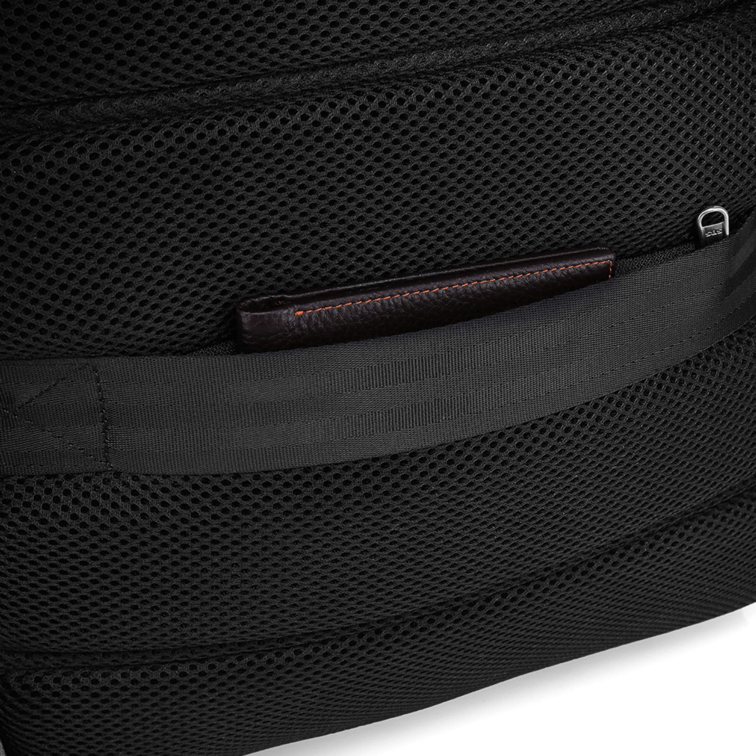 Close-up of a grey backpack with a hidden wallet pocket detail on a white background best travel laptop backpack multi-functional