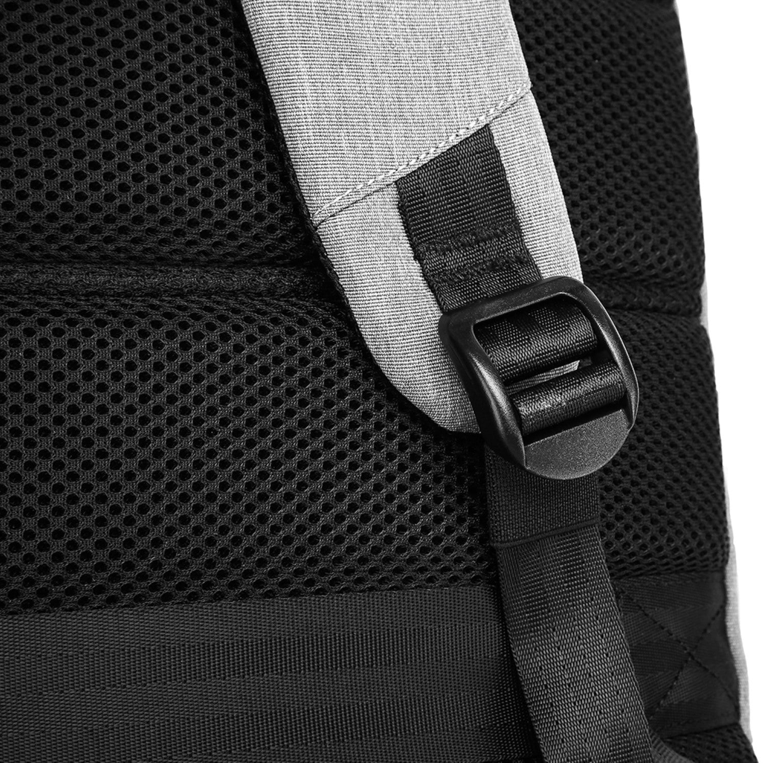 Close-up of a backpack strap with a buckle on a black and gray backpack. best travel laptop backpack multi-functional
