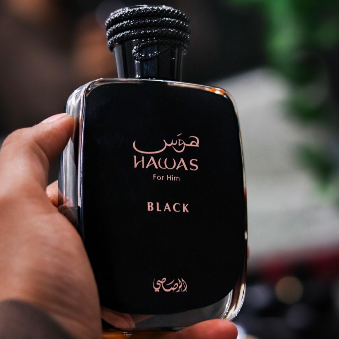 Rasasi Hawas Black Eau de Parfum 100ml bottle held in hand close view