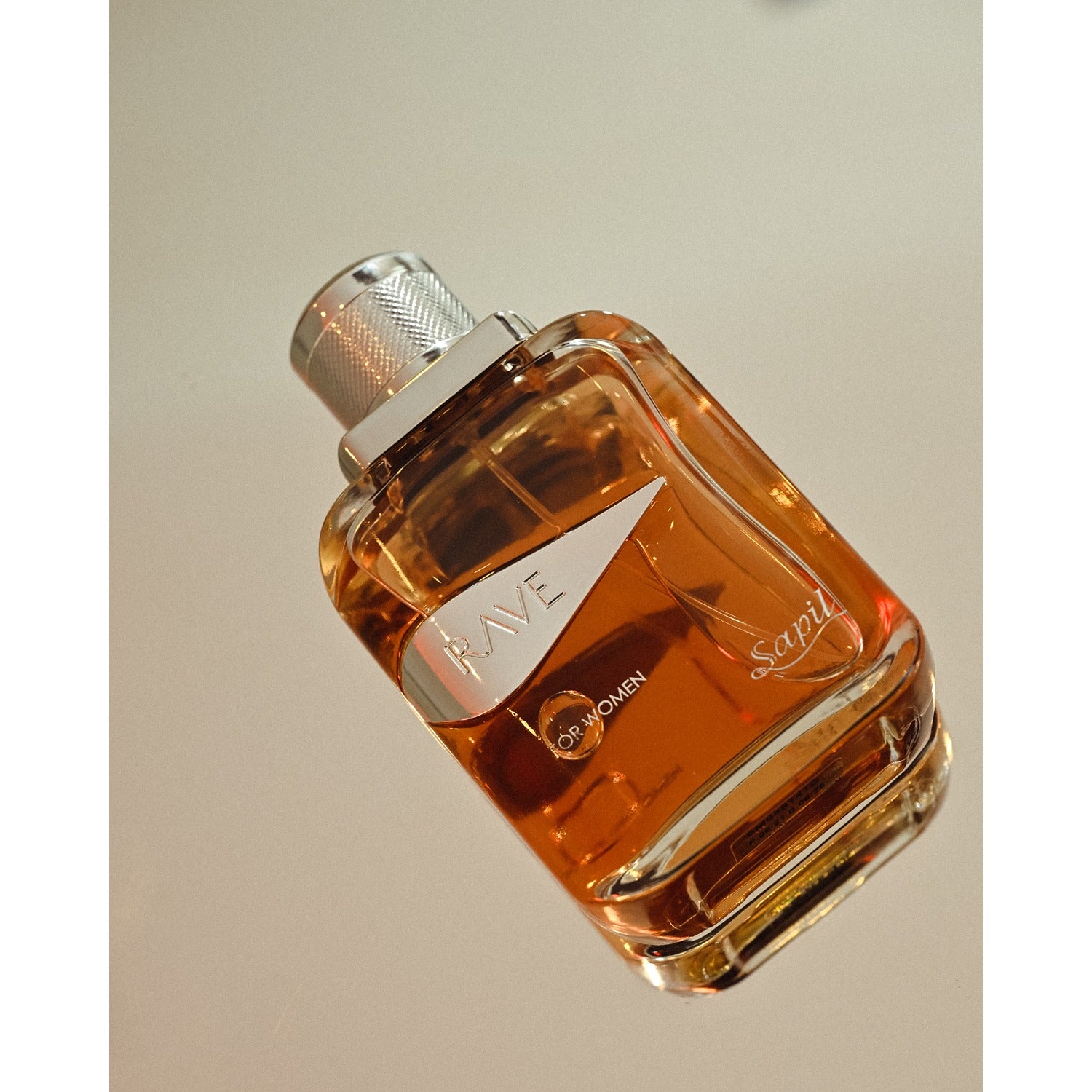 Rave Women Eau de Parfum bottle on neutral background