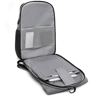 Grey travel commuter backpack with open compartment showing laptop organized slots on a white background by Riseicon