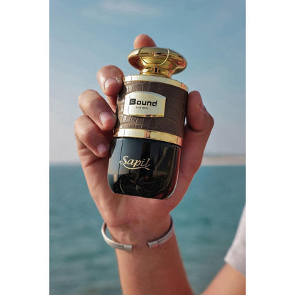 Sapil Bound Gift Set 100ml EDT lifestyle in hand with seaside