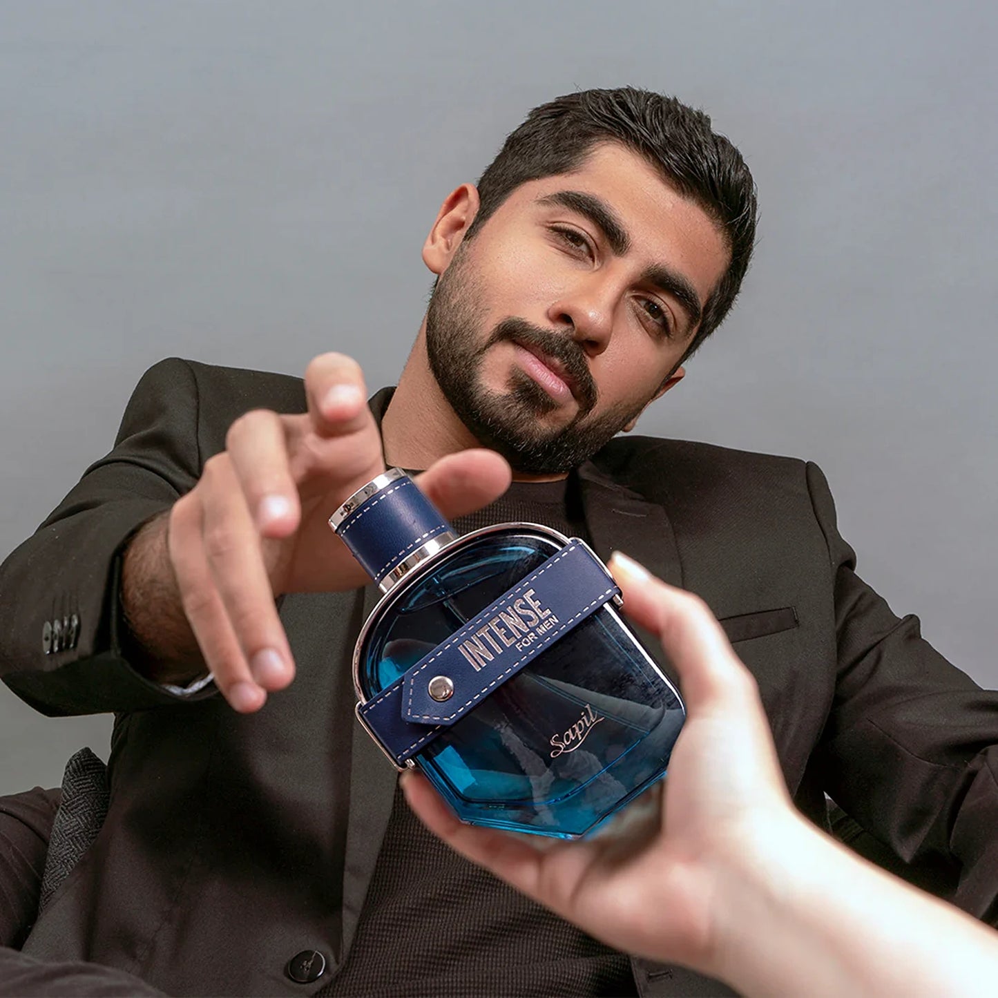Sapil Intense Man 100ml Eau de Toilette lifestyle man holding bottle