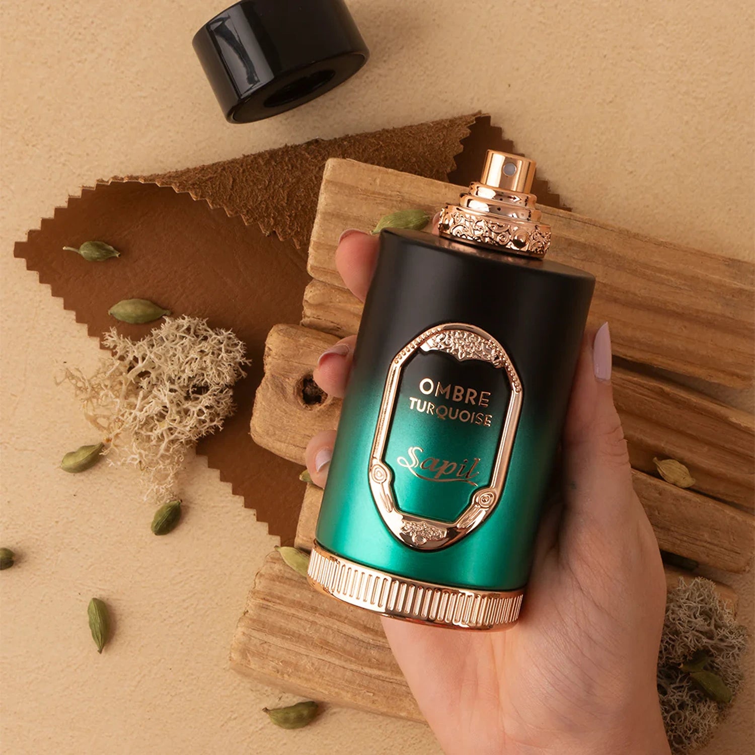 Sapil Ombre Turquoise Eau de Parfum 100ml bottle held in hand