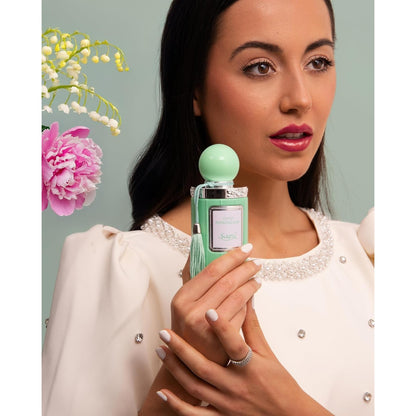 Sapil Yummy Pistachio Oud held by woman in white outfit