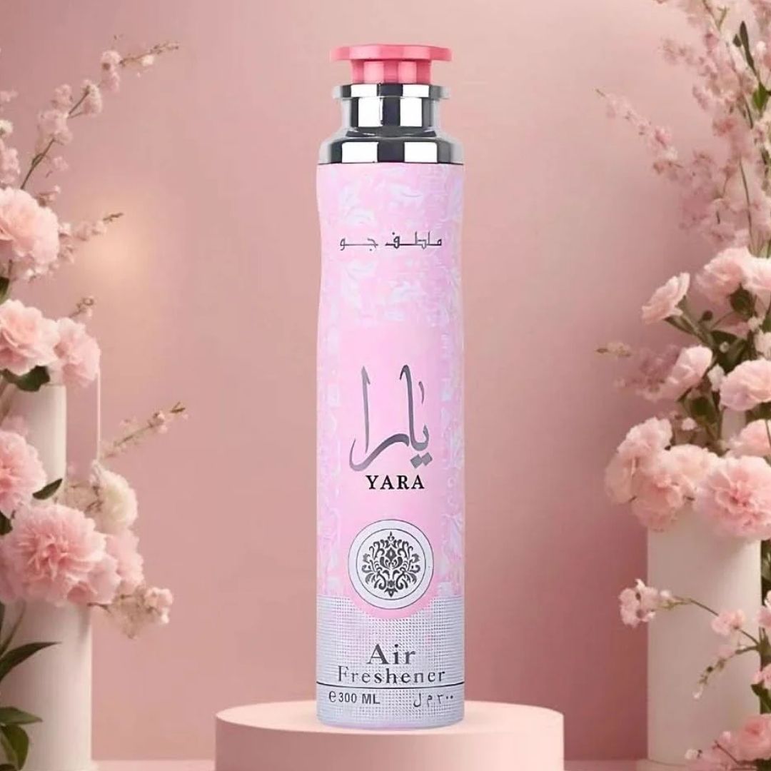 Yara Pink Air Freshener 300ml by Lattafa on stand with blossoms