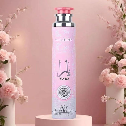 Yara Pink Air Freshener 300ml by Lattafa on stand with blossoms