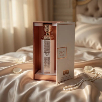 Anfar Mauj bottle inside its open presentation box on cream fabric