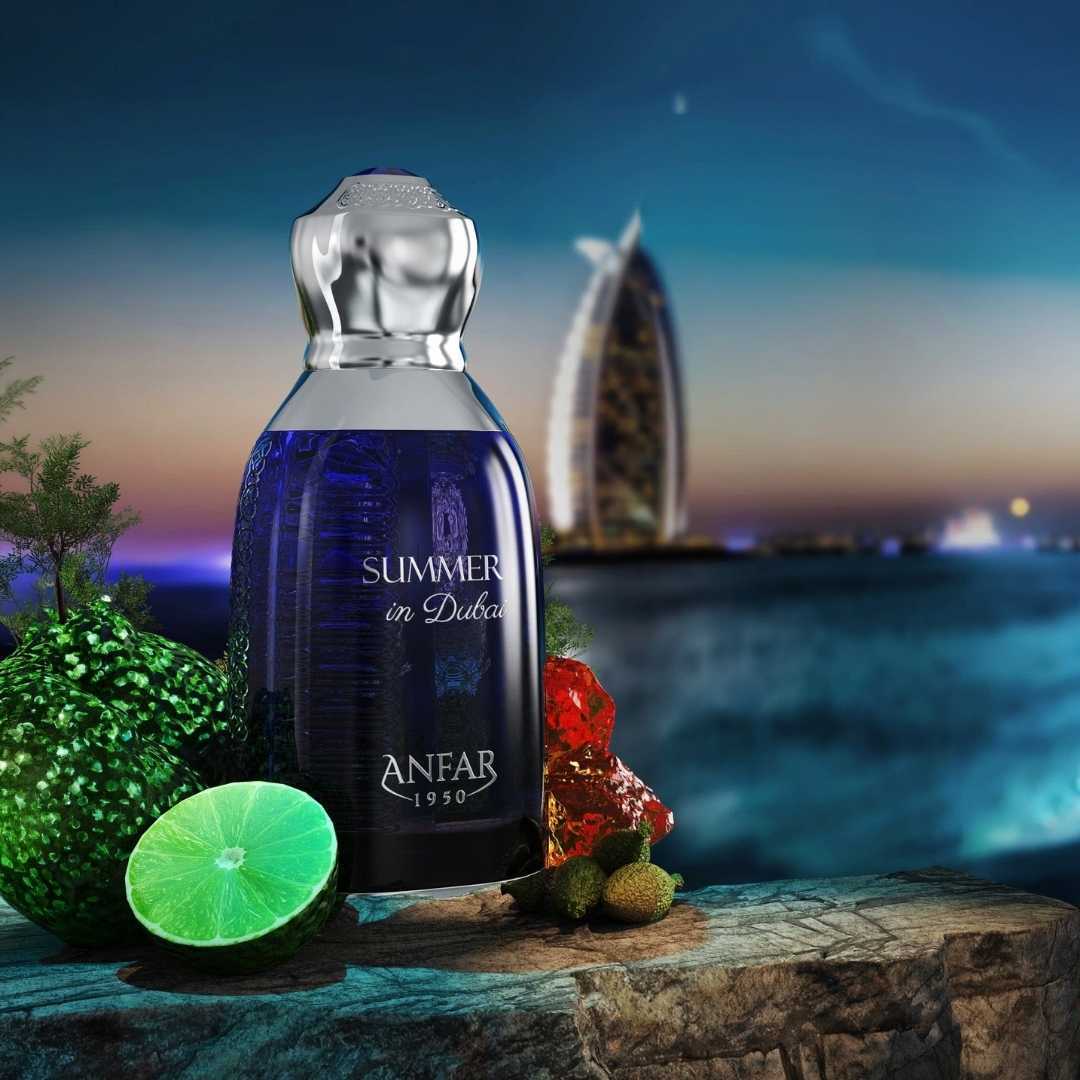 Anfar Summer in Dubai perfume bottle displayed with citrus fruits and Dubai Burj Al Arab skyline at sunset, luxury Arabian summer fragrance by Anfar 1950.