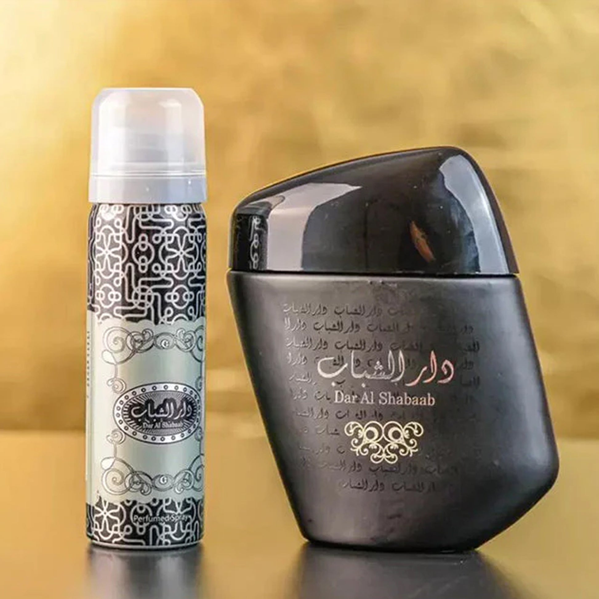 Dar Al Shabaab EDP 100ml with Deodarant by Ard Al Zaafaran bottle and deo on table