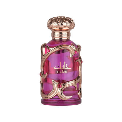 Lattafa Habik for women eau de parfum 100ml in an elegant pink glass bottle with ornate rose gold detailing and a decorative cap, photographed on a clean white background.