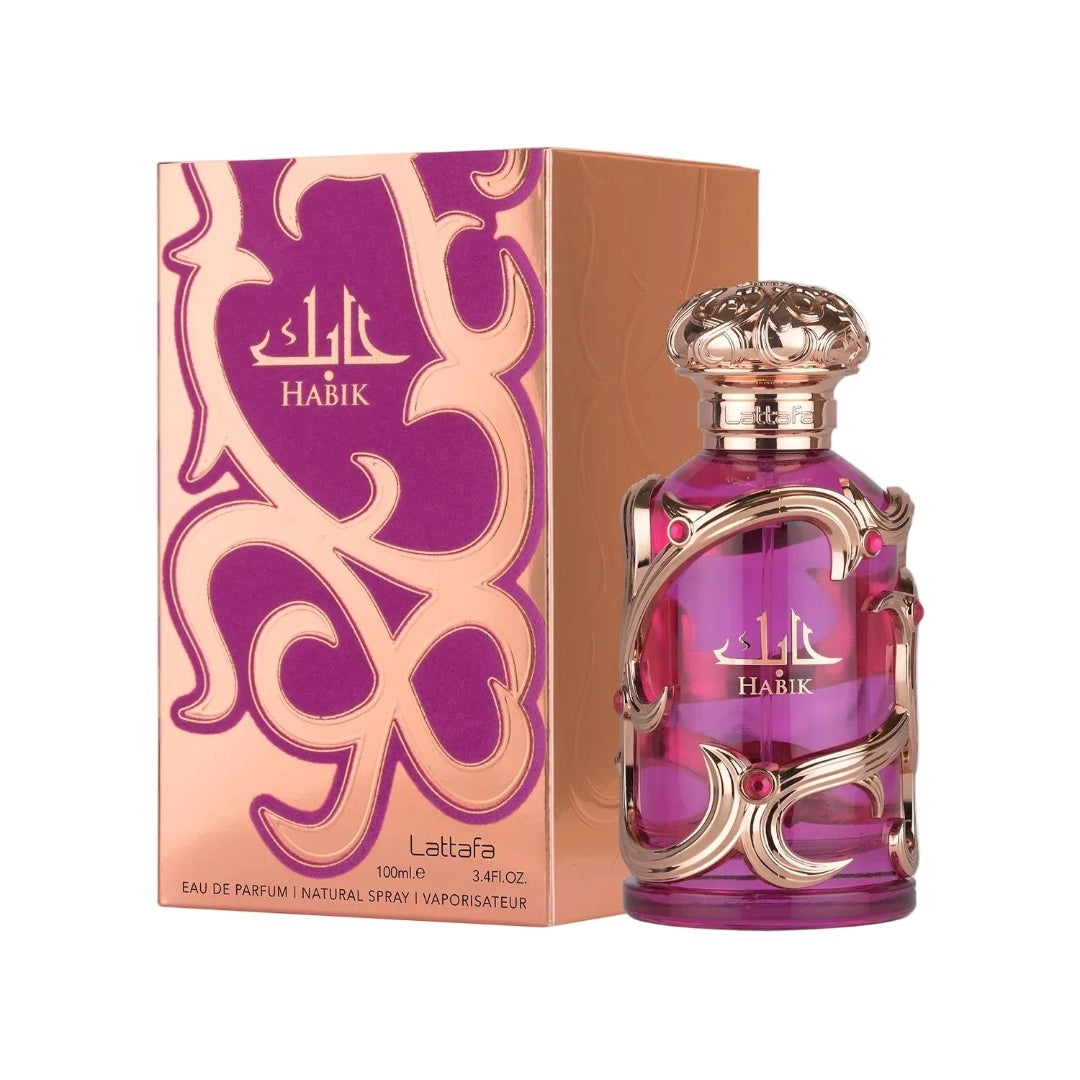 Lattafa Habik women's perfume bottle with pink glass and ornate gold detailing displayed beside its rose gold and purple luxury packaging box.