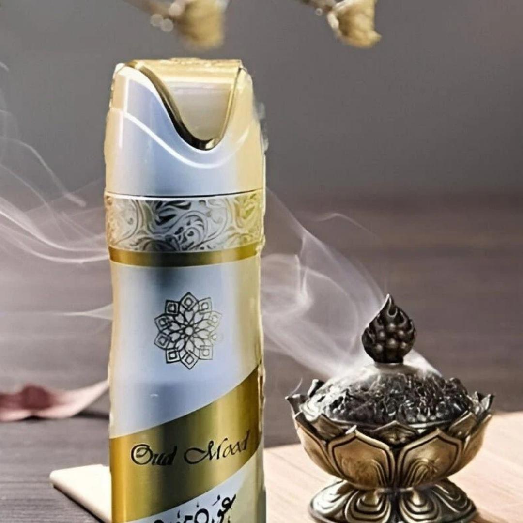 Lattafa Oud Mood perfumed deodorant body spray with rich oud fragrance displayed beside a traditional incense burner with aromatic smoke.