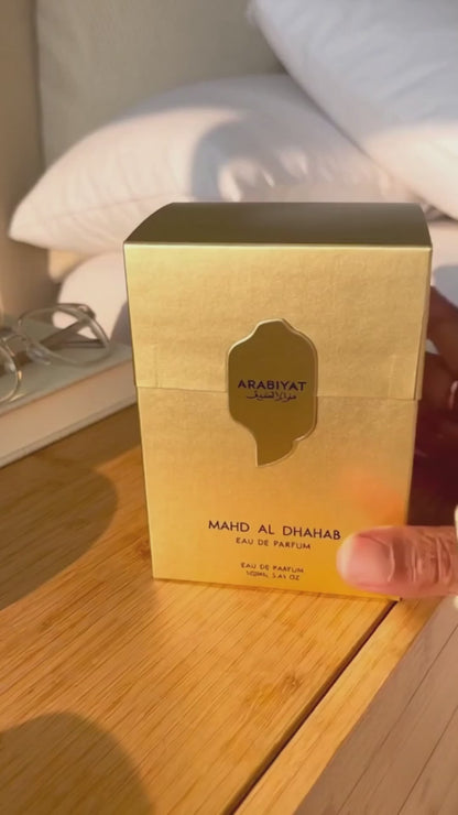 Arabiyat Prestige Mahd Al Dhahab EDP 100ml box on wooden table