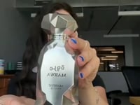 Arabiyat Prestige Marwa Eau de Parfum 100ml for Men bottle held in hand during review