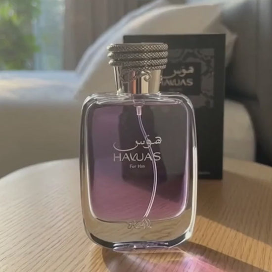 Rasasi Hawas Black Eau de Parfum 100ml bottle on table by window