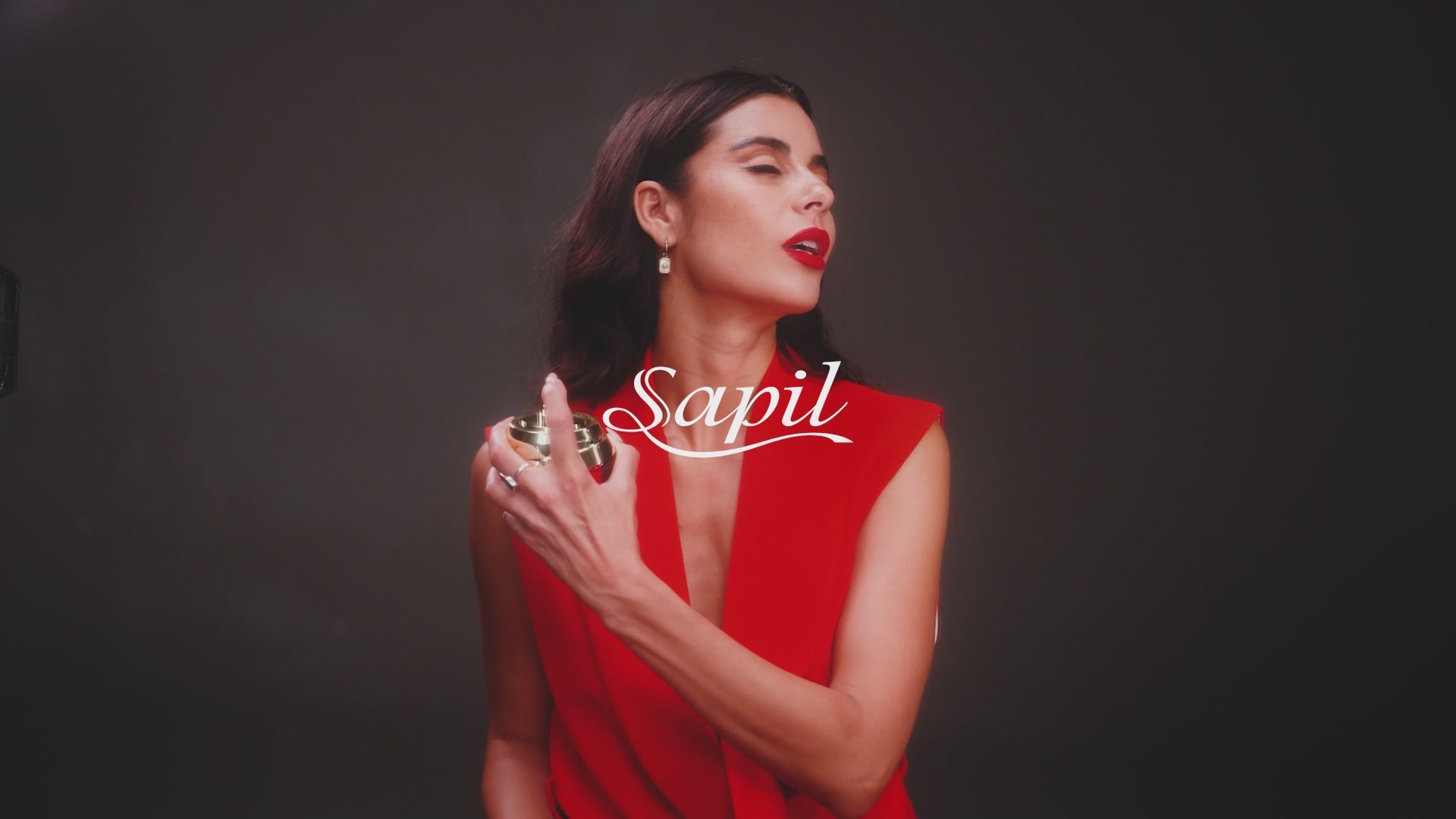 Sapil Rouge Eau de Parfum 100ml video model wearing red dress