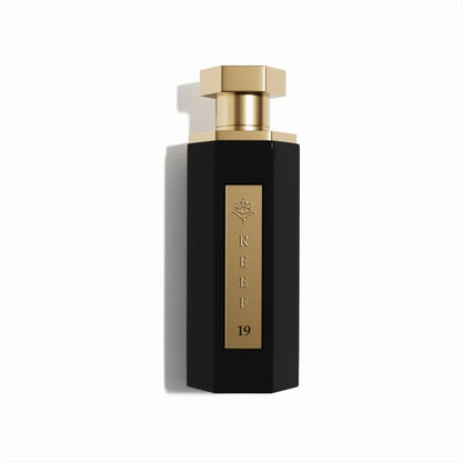 Reef 19 luxury perfume in elegant black bottle with gold cap and gold label, premium Arabian fragrance design for men and women.