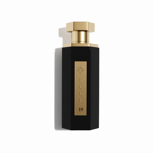 Reef 19 luxury perfume in elegant black bottle with gold cap and gold label, premium Arabian fragrance design for men and women.