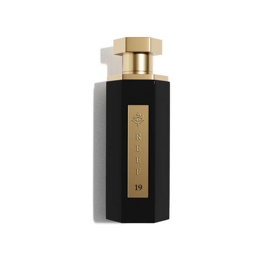 Reef 19 unisex eau de parfum 100ml in a sleek matte black bottle with a gold plaque and cap, photographed on a clean white background with refined luxury styling.