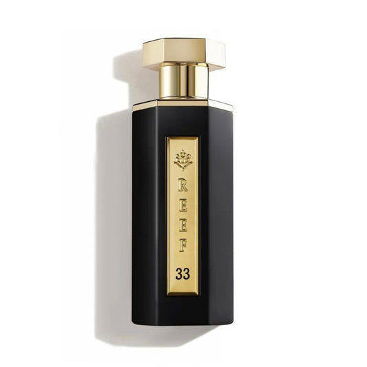 Reef 33 unisex eau de parfum 100ml in a sleek matte black bottle with a gold plaque and cap, photographed on a clean white background with premium luxury styling.