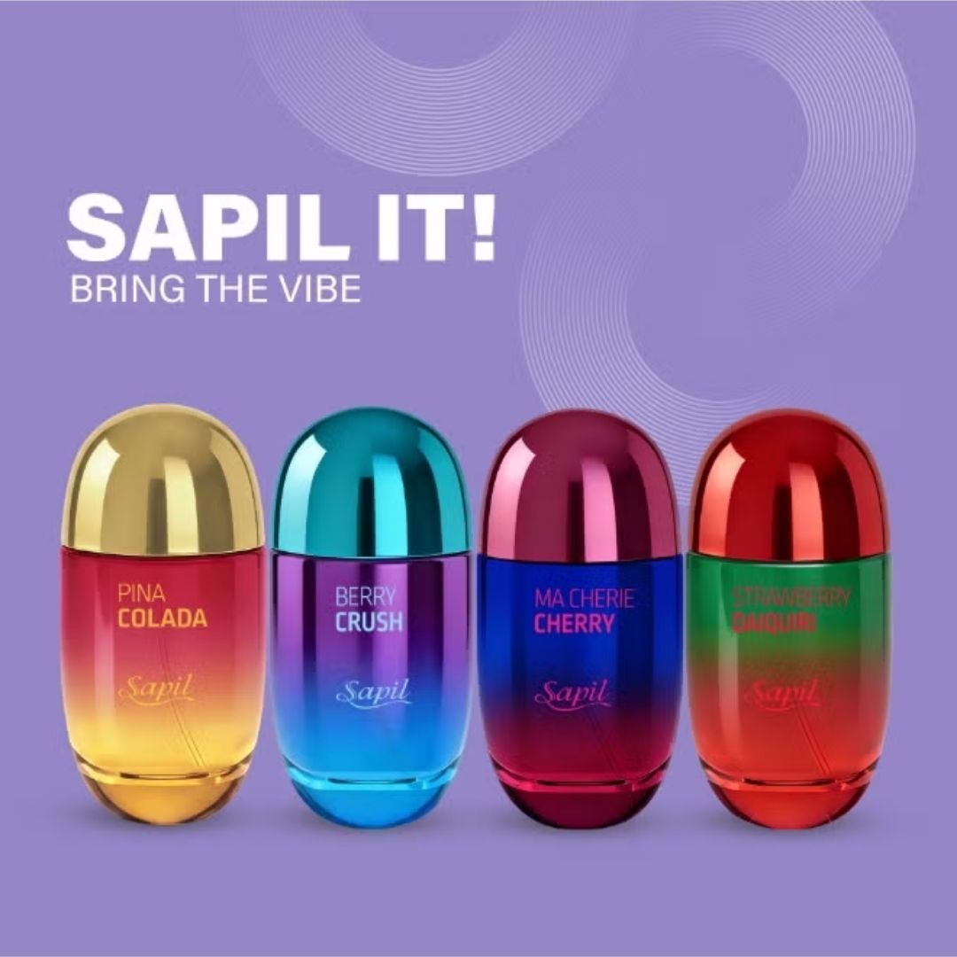 Sapil It fragrance collection featuring Pina Colada, Berry Crush, Ma Cherie Cherry and Strawberry Daiquiri colourful perfume bottles lineup on purple background